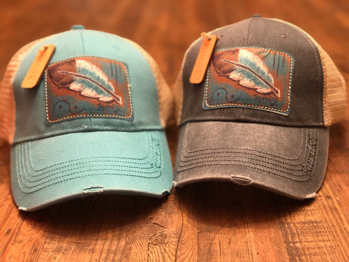 Rural Heart by Rene Earnhardt “Teal Feather” ball cap in denim or teal hat with Velcro closure.