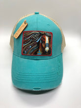 Rural Heart by Rene Earnhardt “Spirit Runner” ball cap in denim or turquoise hat with Velcro closure.