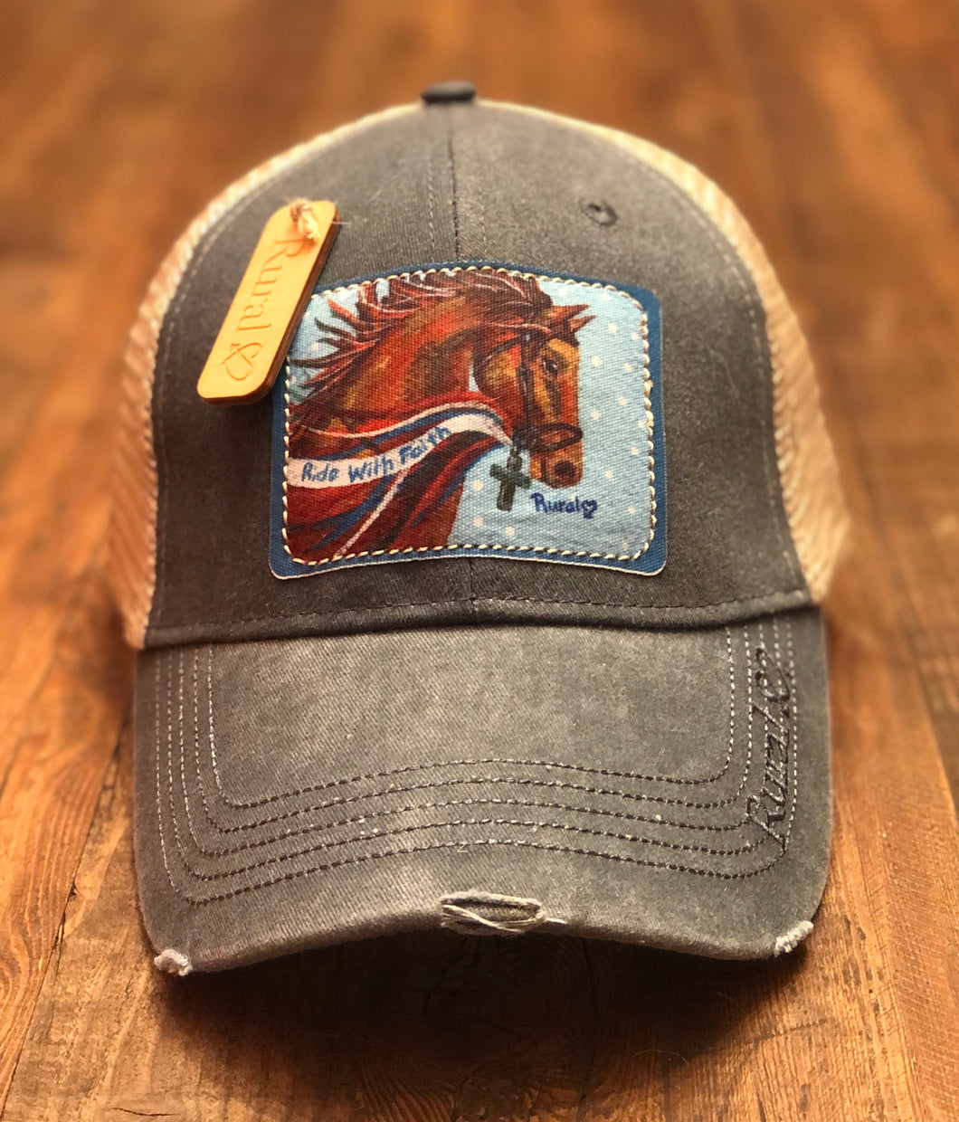 Rural Heart by Rene Earnhardt “Ride with Faith” ball cap in denim hat with Velcro closure.