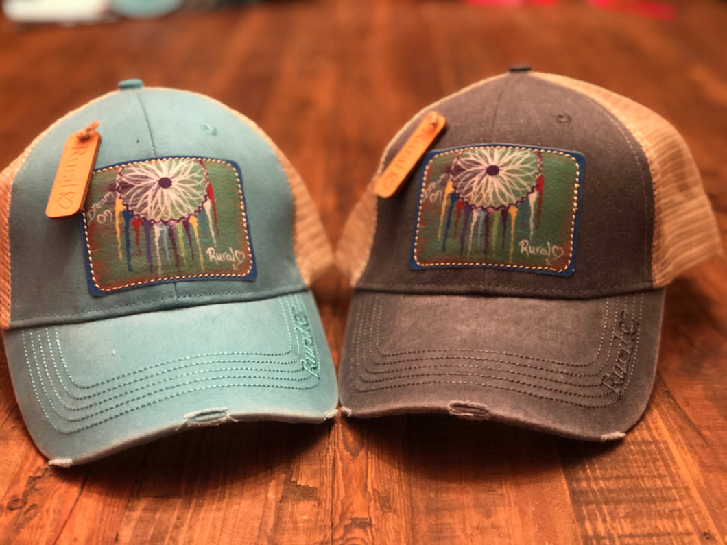Rural Heart by Rene Earnhardt “Dream On” ball cap in denim or teal hat with Velcro closure.